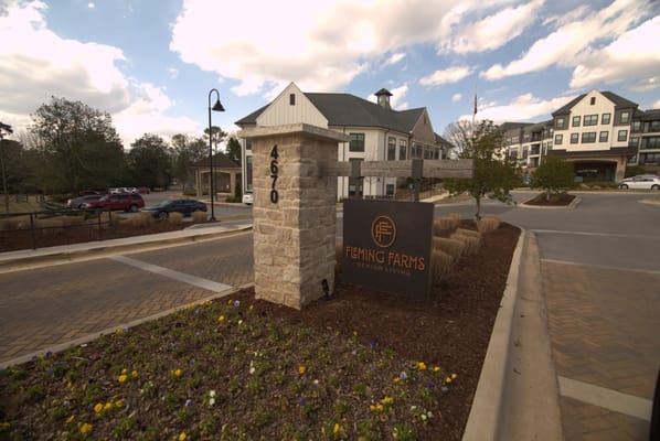 Fleming Farms Senior Living sign at the entrance