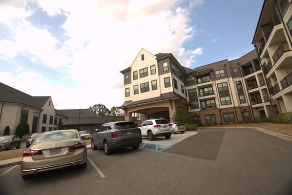 Exterior view of Fleming Farms Senior Living with parking