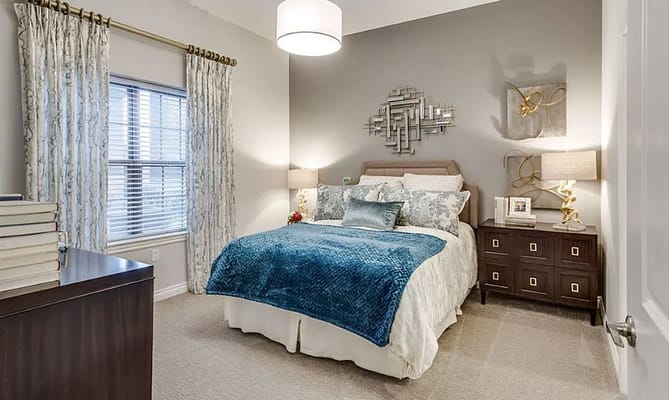 Stylish bedroom with blue accents and natural light