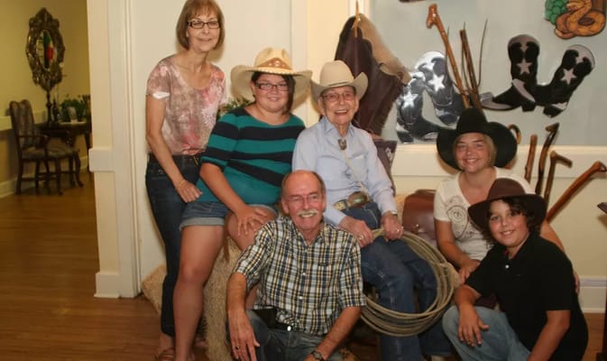 Residents and staff posing together in a common area