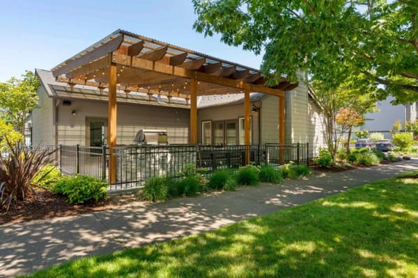 Outdoor patio with pergola and seating at Forest Hills