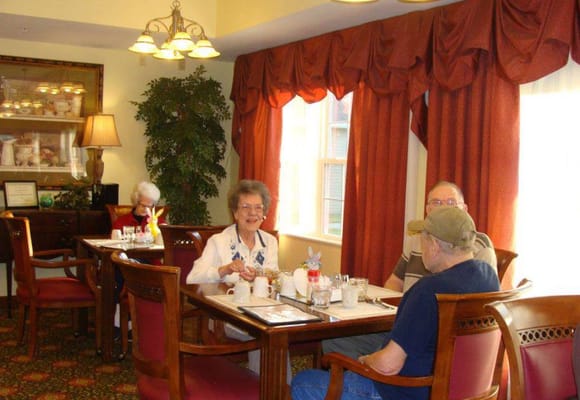 Residents enjoying a meal in the dining room