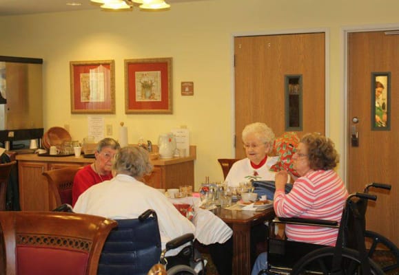 Residents having a meal in the dining room