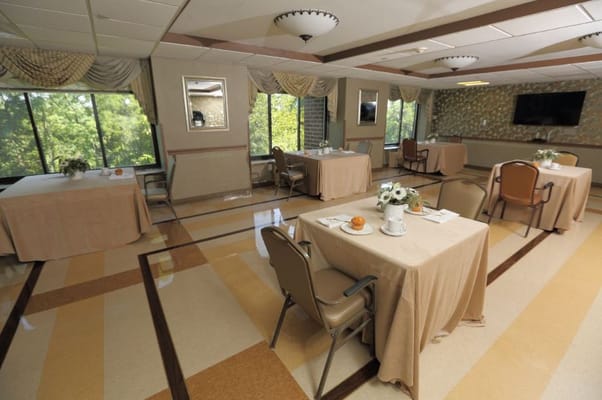 Bright dining room with tables set for meals