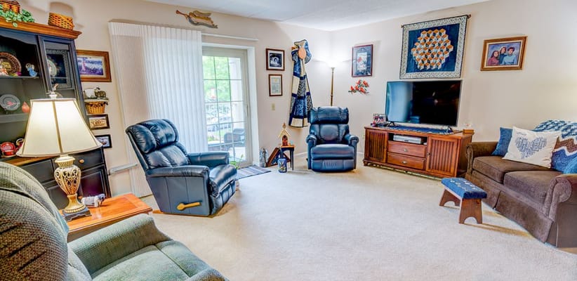 Spacious living room with comfortable seating and decor