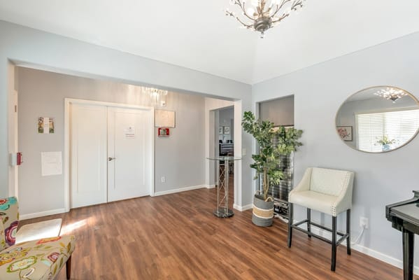 Inviting lobby area with seating and decor at Gardens Care Senior Living.