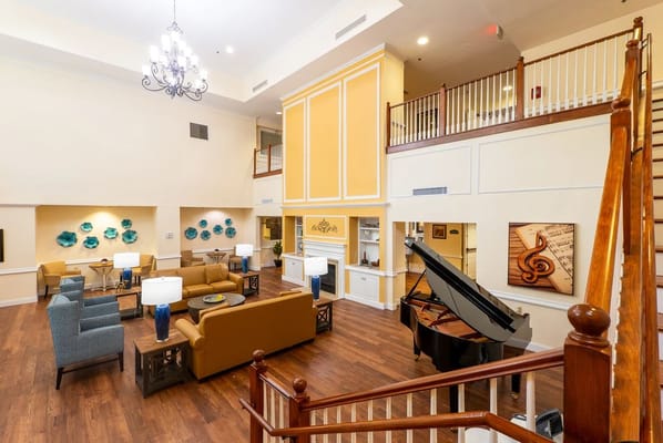 Interior common area with seating and a piano