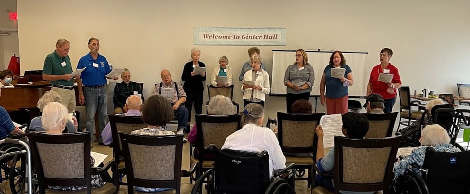 Residents participating in a group singing activity