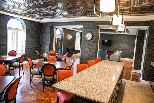 Bright common area with tables and chairs