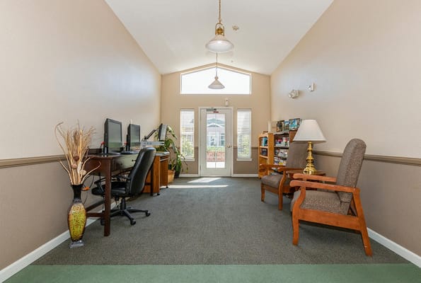 Bright and inviting common area with seating and computers