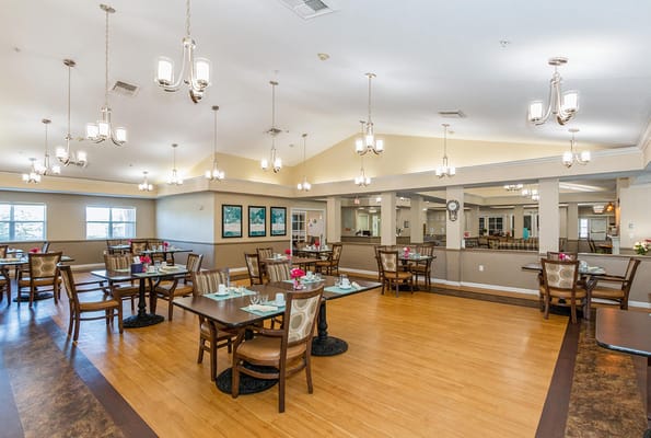 Bright dining area with tables and chairs