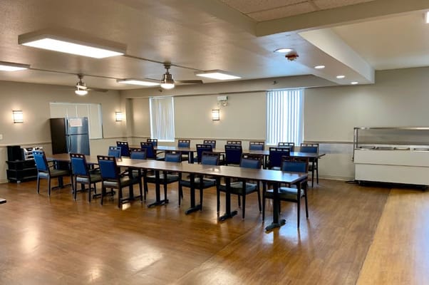 Dining area with tables and chairs in a well-lit room