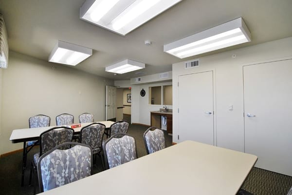Bright meeting room with tables and chairs