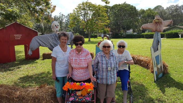 Residents enjoying a fall-themed outdoor activity