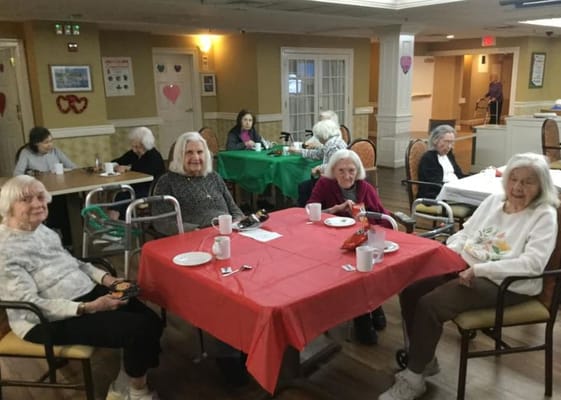 Residents enjoying coffee and conversation at a social event