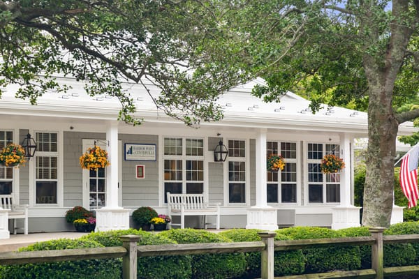Exterior view of Harbor Point at Centerville with hanging flower baskets