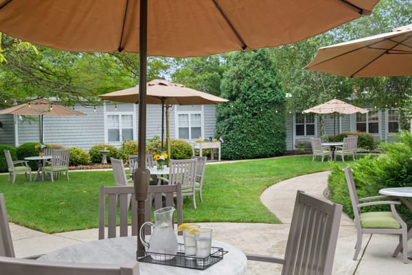 Sunny outdoor patio with seating and umbrellas