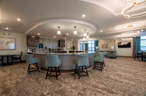 Bright common area with seating and bar