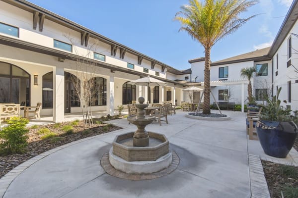 Outdoor courtyard with seating and a fountain