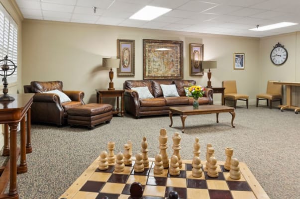 Cozy lounge area featuring a chess set and comfortable seating