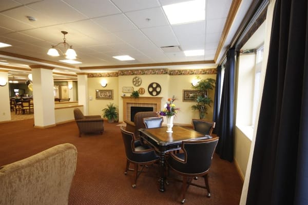 Cozy seating area with a dining table and decorative plants.