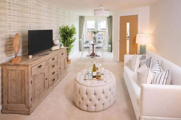Stylish living room with a TV, sofa, and dining area