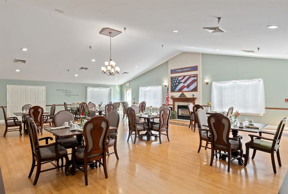 Interior view of the dining room with tables set for meals