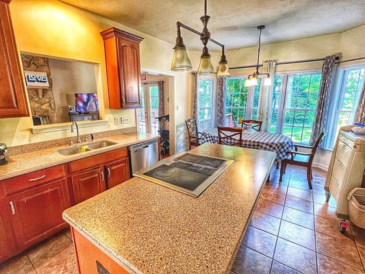 Bright kitchen with large windows and outdoor view