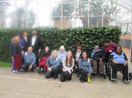Residents and staff gathered outdoors for a group photo