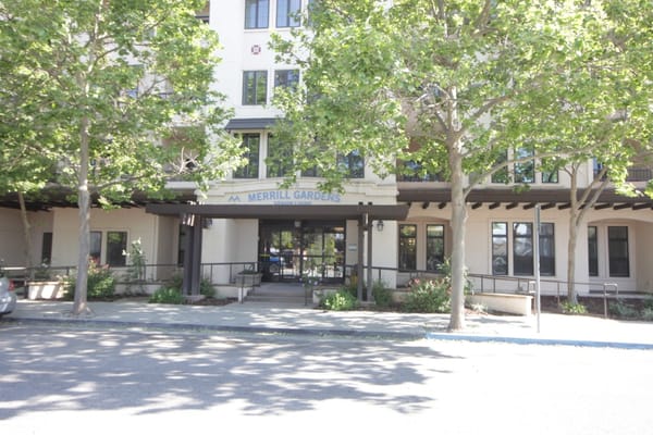 Main entrance of Merrill Gardens with landscaping