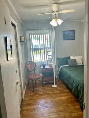 A well-furnished private resident room with natural light