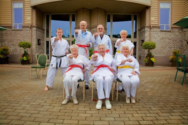 Residents practicing martial arts outside the facility