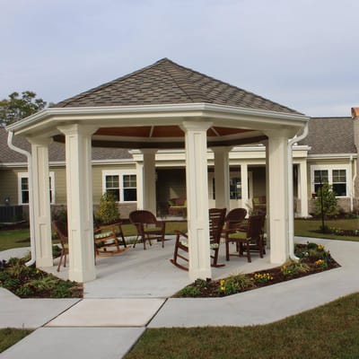 Outdoor gazebo with seating in a garden area