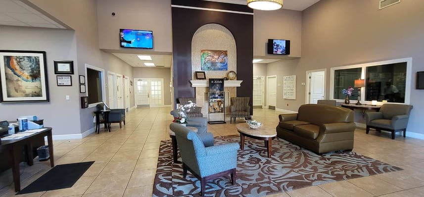 Spacious and inviting lobby with comfortable seating and decorative elements