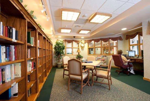 Interior common area with bookshelves and a computer station