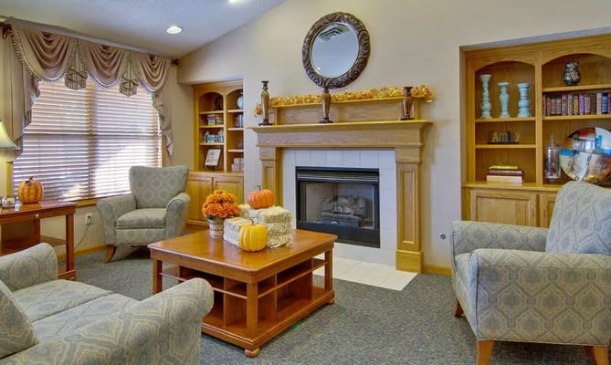 Lounge area with comfortable seating and a fireplace