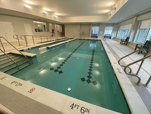 Indoor swimming pool area in a senior living facility