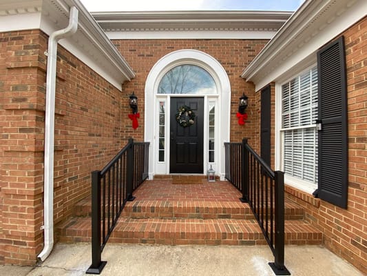 Entrance with brick facade and Christmas decorations