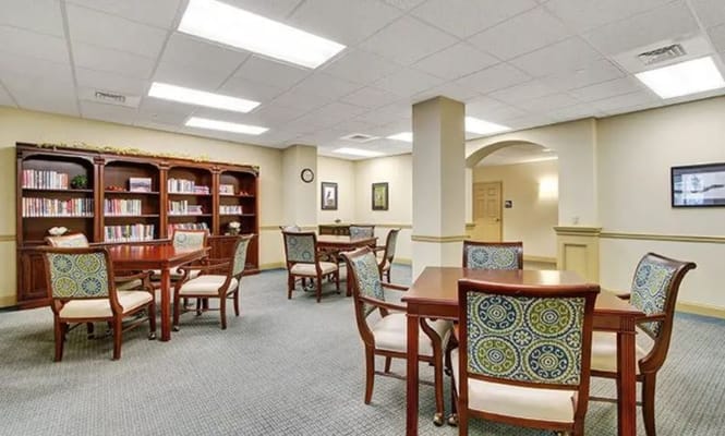 Interior common area with tables and bookshelf