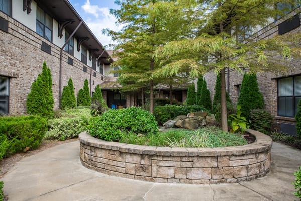Outdoor courtyard with landscaped garden and seating area