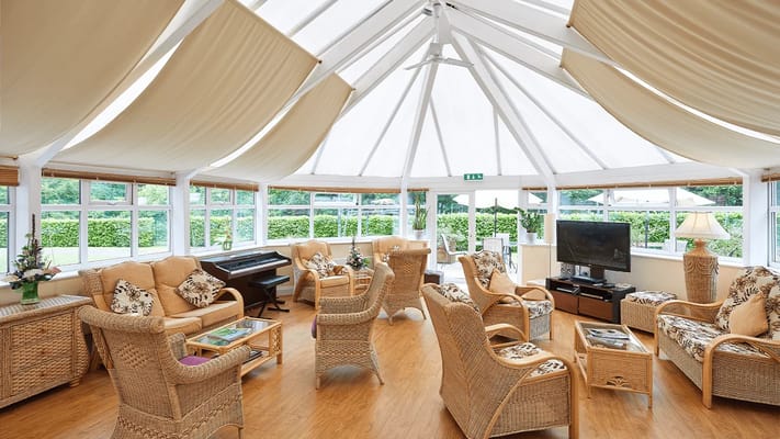 Bright common area with comfortable seating and large windows