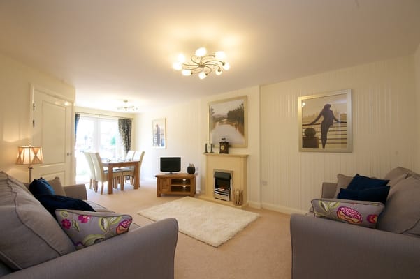 Bright and cozy common area with seating and decor