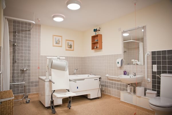 Accessible bathroom with safety features and neutral decor