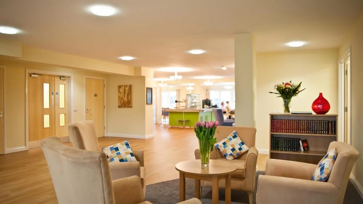 Bright common area with seating and flowers