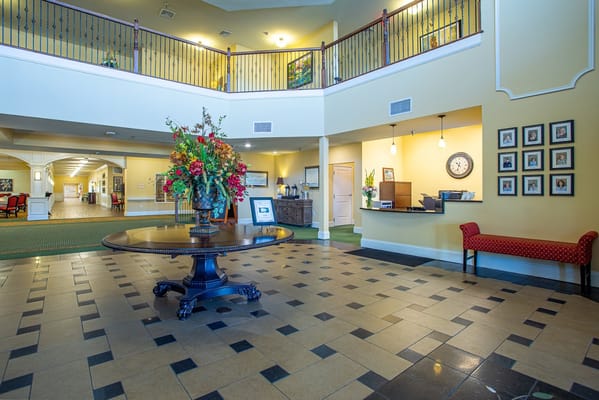 Bright interior of a lobby with floral arrangement