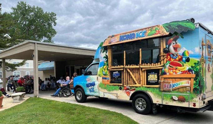 Residents enjoying ice treats outside the facility