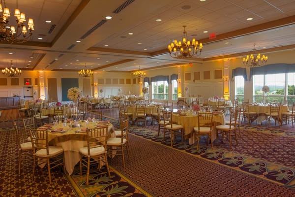 Elegant dining room set for an event with chandeliers