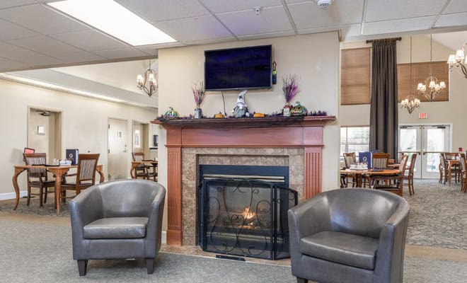 Cozy common area with a fireplace and seating