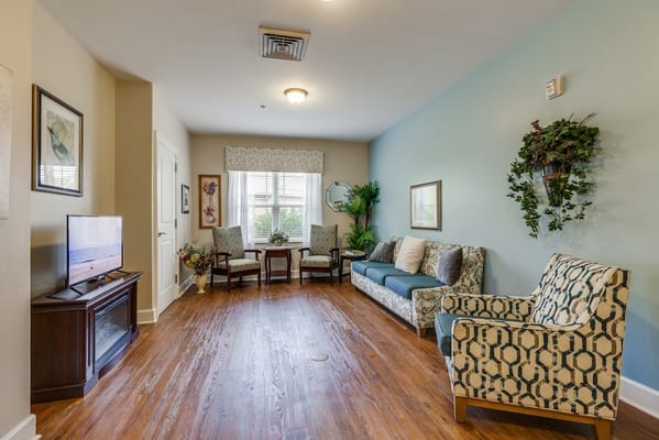 Lounge area with seating and a television.