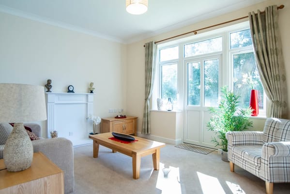 Bright common area with seating and large windows